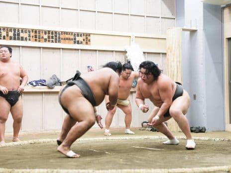 Sumo wrestlers train in their practice ring